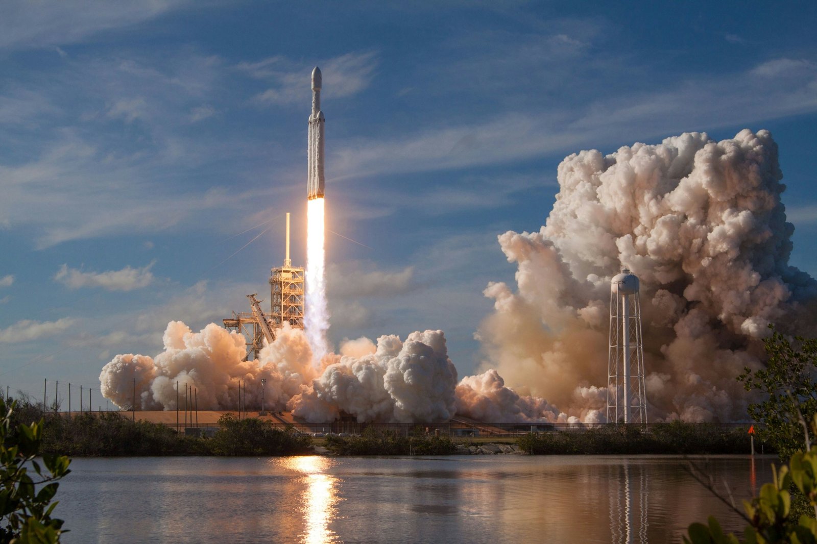 Rocket lifting off over water
